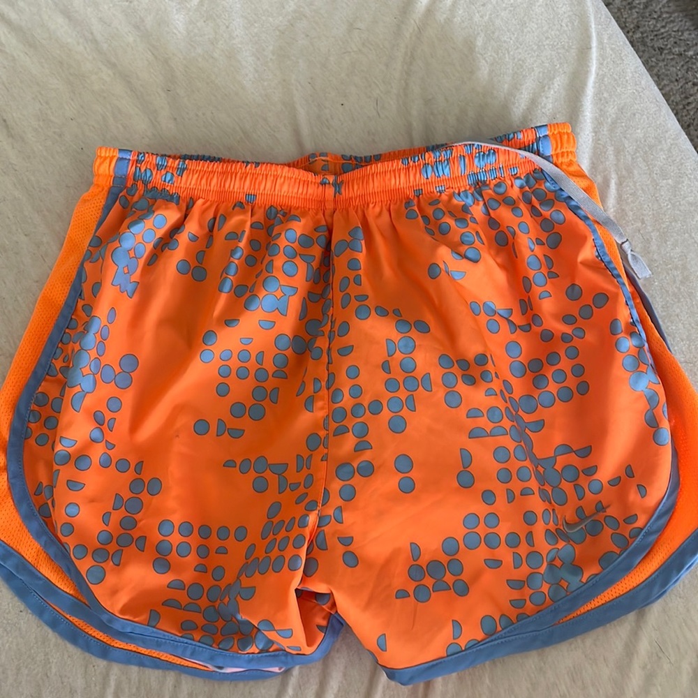 Orange and blue Nike running shorts